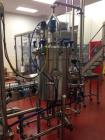 Used 2 oz. Energy Shot Bottle Filling Line. Includes: New England Model NEHCPCL bottle unscrambler with bottle elevator, capable of 250/minute. DTM Purefil 2000 12-head straightline continuous motion...