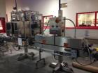 Used 2 oz. Energy Shot Bottle Filling Line. Includes: New England Model NEHCPCL bottle unscrambler with bottle elevator, capable of 250/minute. DTM Purefil 2000 12-head straightline continuous motion...