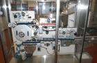 Used 2 oz. Energy Shot Bottle Filling Line. Includes: New England Model NEHCPCL bottle unscrambler with bottle elevator, capable of 250/minute. DTM Purefil 2000 12-head straightline continuous motion...