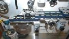 Used 2 oz. Energy Shot Bottle Filling Line. Includes: New England Model NEHCPCL bottle unscrambler with bottle elevator, capable of 250/minute. DTM Purefil 2000 12-head straightline continuous motion...