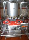 Used 2 oz. Energy Shot Bottle Filling Line. Includes: New England Model NEHCPCL bottle unscrambler with bottle elevator, capable of 250/minute. DTM Purefil 2000 12-head straightline continuous motion...