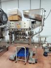 Used Acasi Model Tru-PI-12-V Automatic Inline Piston Filling Line Last Running Sauces. Consists of (2) Acasi Model Tru-12-VS Fillers, Resina Model NRC 40 inline quill capper, Acasi Trucap8-Vib capper...