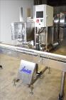 Used Accutek 6 Automatic Vacuum Liquid Filling Line for Glass Containers.