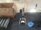 Used Accutek Table Top Filling System, semi-auto operation, consisting of; Mini-Pinch (Six Head) Timed Flow Volumetric Filler, with Adjustable Table Top Stand, Fill Wand, Individual Flow Control Adju...
