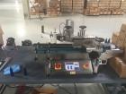 Used Accutek Table Top Filling System, semi-auto operation, consisting of; Mini-Pinch (Six Head) Timed Flow Volumetric Filler, with Adjustable Table Top Stand, Fill Wand, Individual Flow Control Adju...