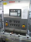 Used Bosch MRF 1010 Bottle Filling/Closing Machine. Filling range 0.1 - 8.5 fl oz (0.5 - 250 ml), output 3,000 bottles an hour. 4 Filling stations with rotary slide piston pumps, capper, torque-screw...