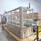 Used Capmatic Bottling Line, Model Verifill. Line consists of: (1) Capmatic Bottle Cleaner, (1) Capmatic rotary chuck capper, model Roadrunner 4HM, (1) LSI pressure sensitive wraparound labeler, mode...