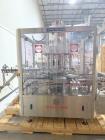 Used Capmatic Bottling Line, Model Verifill. Line consists of: (1) Capmatic Bottle Cleaner, (1) Capmatic rotary chuck capper, model Roadrunner 4HM, (1) LSI pressure sensitive wraparound labeler, mode...
