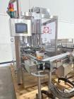 Used Capmatic Bottling Line, Model Verifill. Line consists of: (1) Capmatic Bottle Cleaner, (1) Capmatic rotary chuck capper, model Roadrunner 4HM, (1) LSI pressure sensitive wraparound labeler, mode...
