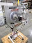Used Capmatic Bottling Line, Model Verifill. Line consists of: (1) Capmatic Bottle Cleaner, (1) Capmatic rotary chuck capper, model Roadrunner 4HM, (1) LSI pressure sensitive wraparound labeler, mode...