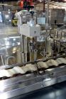 Used Capmatic Straight Line Automatic “Puck Style” Fragrance Line, Model Patriot L, S/N PA03101111, new 2004.  3/60/480V/20A.  6 Head Straight Line Vacuum Filler, Model Vacufill, S/N RV03101110, with...
