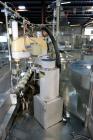 Used Capmatic Straight Line Automatic “Puck Style” Fragrance Line, Model Patriot L, S/N PA03101111, new 2004.  3/60/480V/20A.  6 Head Straight Line Vacuum Filler, Model Vacufill, S/N RV03101110, with...