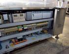 Used Capmatic Straight Line Automatic “Puck Style” Fragrance Line, Model Patriot L, S/N PA03101111, new 2004.  3/60/480V/20A.  6 Head Straight Line Vacuum Filler, Model Vacufill, S/N RV03101110, with...