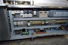 Used Capmatic Straight Line Automatic “Puck Style” Fragrance Line, Model Patriot L, S/N PA03101111, new 2004.  3/60/480V/20A.  6 Head Straight Line Vacuum Filler, Model Vacufill, S/N RV03101110, with...
