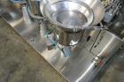 Used Capmatic Straight Line Automatic “Puck Style” Fragrance Line, Model Patriot L, S/N PA03101111, new 2004.  3/60/480V/20A.  6 Head Straight Line Vacuum Filler, Model Vacufill, S/N RV03101110, with...