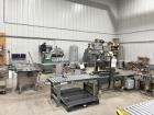 Used Inline Filling Systems Complete Liquid Filling Line. Line Consists of 10 Head Inline Fillers, Kapsall Model A6-R Capper with Integrated Cap Elevator and Centrifugal Cap Sorter, Dual Belt, Kapsal...
