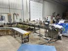 Used Inline Filling Systems Complete Liquid Filling Line. Line Consists of 10 Head Inline Fillers, Kapsall Model A6-R Capper with Integrated Cap Elevator and Centrifugal Cap Sorter, Dual Belt, Kapsal...