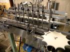 Used Kalish Liquid Bottle Filling Lineconsisting of: (1) Kalishtronic 8 head inline bottom up filler, Model KT12. (8) 5/8’’ diameter x 8-7/8’’ long diving nozzles, set up for approximately 946 ml. (8...
