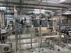 Used Complete Filling line for Bottle, manufactured by Norland. Running 25oz Bottles