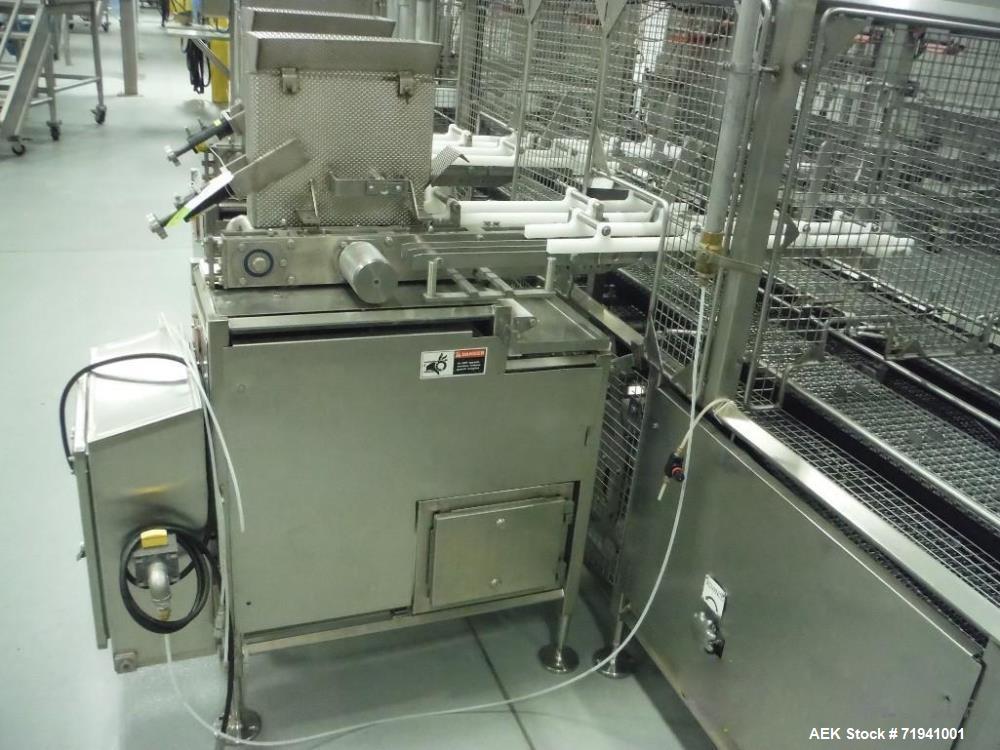 Used Complete Flexline Frozen Meal Kitchen and Assembly Production Line. Accuracy: Precision meal component placement within a tray. Variety: 11 depositing stations for meal components, sauce, glaze ...