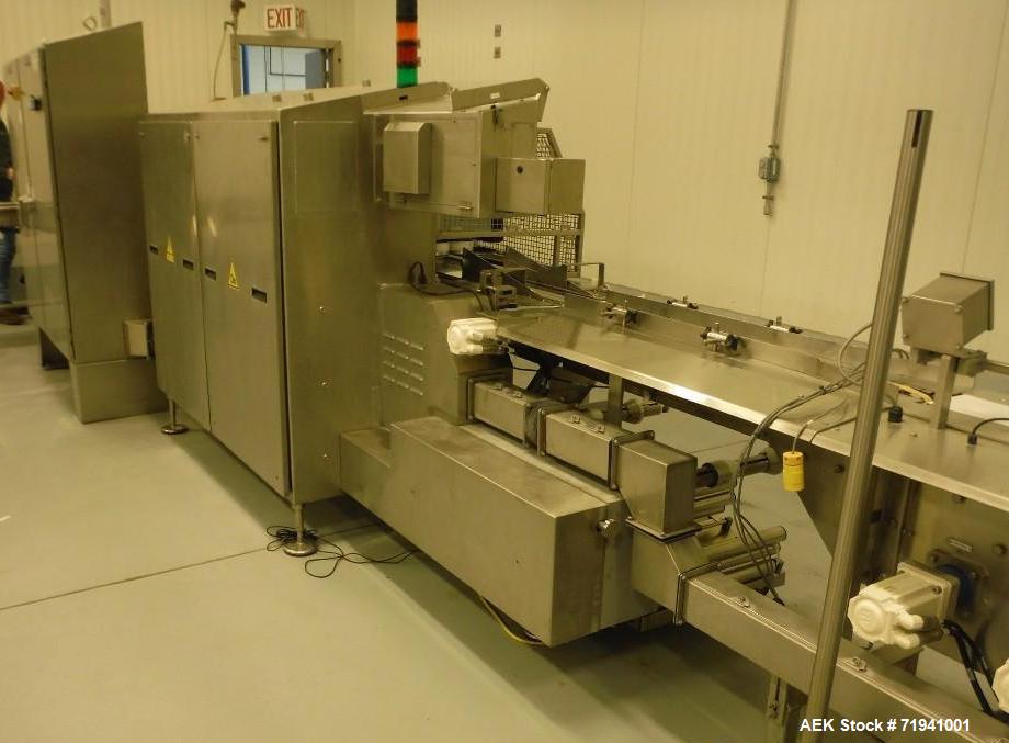 Used Complete Flexline Frozen Meal Kitchen and Assembly Production Line. Accuracy: Precision meal component placement within a tray. Variety: 11 depositing stations for meal components, sauce, glaze ...