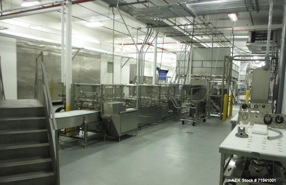 Used Complete Flexline Frozen Meal Kitchen and Assembly Production Line. Accuracy: Precision meal component placement within a tray. Variety: 11 depositing stations for meal components, sauce, glaze ...