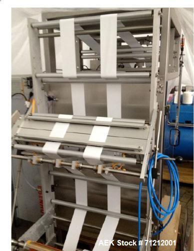 Used Pouch Packaging line. Capacity 2 x 80 trays / minute. Line consists of Hassia model TC55 Chipboard hooded tray former for top load packing, Rovema model BC260 pouch packager discharging to top l...