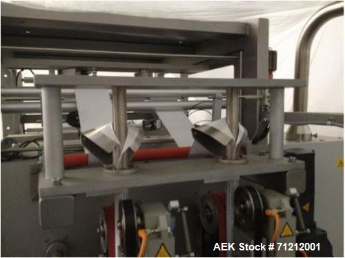 Used Pouch Packaging line. Capacity 2 x 80 trays / minute. Line consists of Hassia model TC55 Chipboard hooded tray former for top load packing, Rovema model BC260 pouch packager discharging to top l...