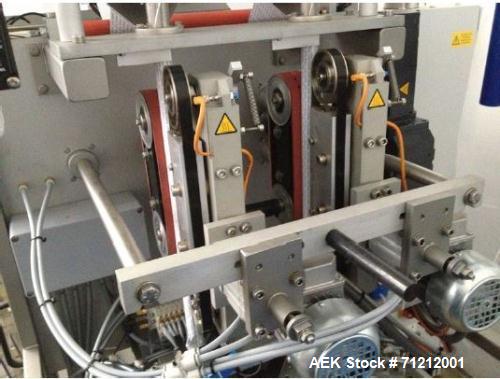 Used Pouch Packaging line. Capacity 2 x 80 trays / minute. Line consists of Hassia model TC55 Chipboard hooded tray former for top load packing, Rovema model BC260 pouch packager discharging to top l...