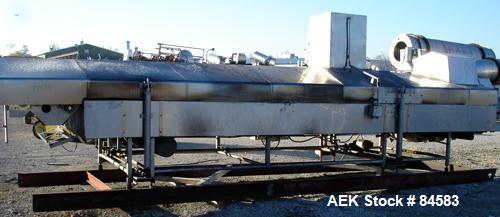 USED: Heat & Controls corn chip line, model CC-2.0 fryer, serial#178556. 58" wide x 21' long fry bed, wire woven mesh. . Stainless steel frame and hood. Seasoning hopper with36" long x 2" diameter fe...