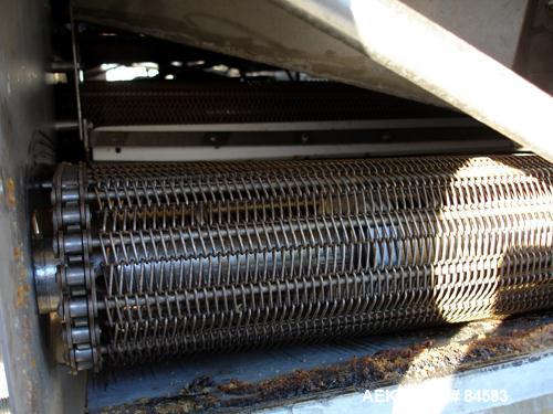 USED: Heat & Controls corn chip line, model CC-2.0 fryer, serial#178556. 58" wide x 21' long fry bed, wire woven mesh. . Stainless steel frame and hood. Seasoning hopper with36" long x 2" diameter fe...