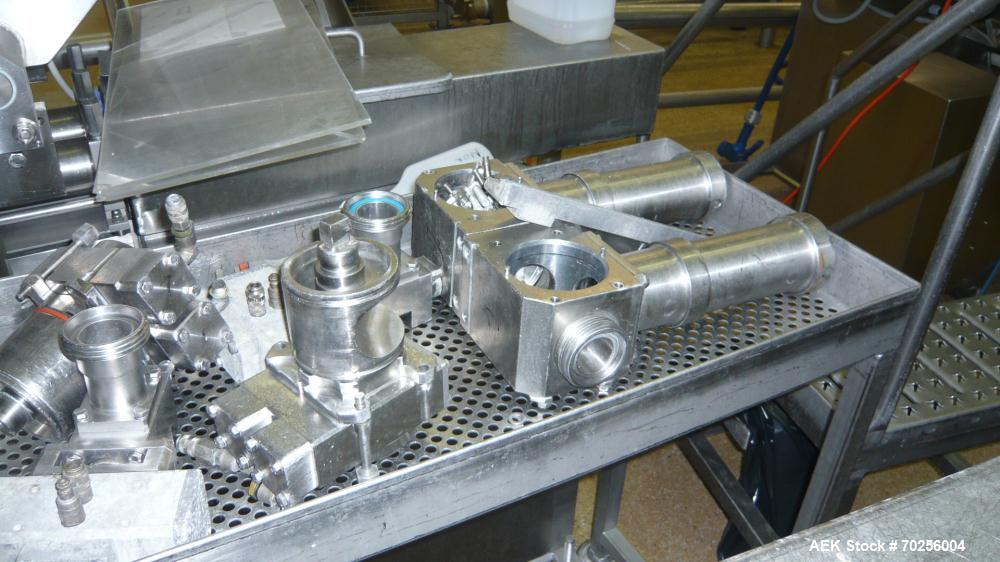Used Mondini Line for Packaging Dough. (1) Unfeeder for cups. (2) 2 Mondini dosers. (3) Mondini sealer. Stainless steel.