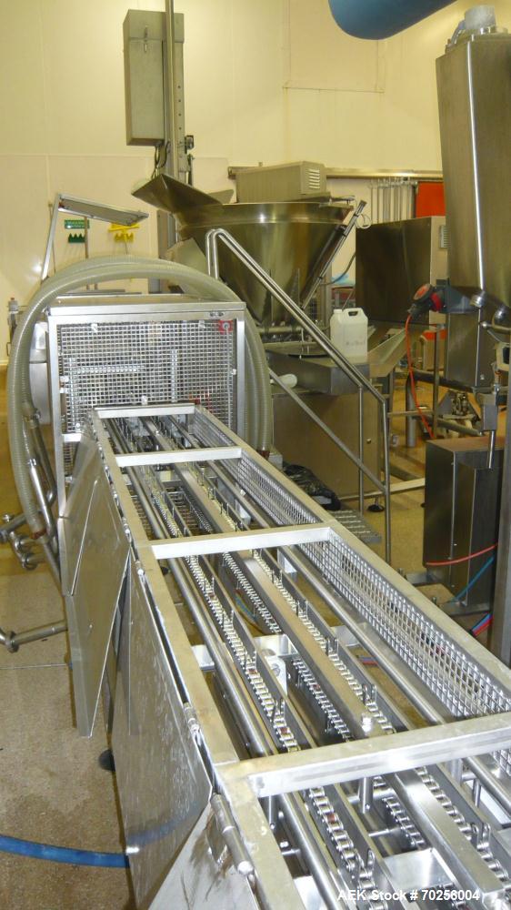 Used Mondini Line for Packaging Dough. (1) Unfeeder for cups. (2) 2 Mondini dosers. (3) Mondini sealer. Stainless steel.