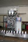 Used Pouch Packaging line. Capacity 2 x 80 trays / minute. Line consists of Hassia model TC55 Chipboard hooded tray former for top load packing, Rovema model BC260 pouch packager discharging to top l...