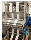 Used Pouch Packaging line. Capacity 2 x 80 trays / minute. Line consists of Hassia model TC55 Chipboard hooded tray former for top load packing, Rovema model BC260 pouch packager discharging to top l...