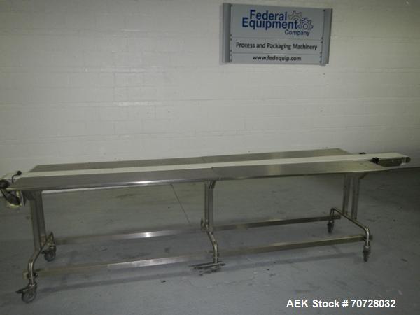 Used Pack off conveyor, 6" wide x 11' long slat conveyor, 12" stainless steel side extensions, .13 hp dc motor drive on stands.