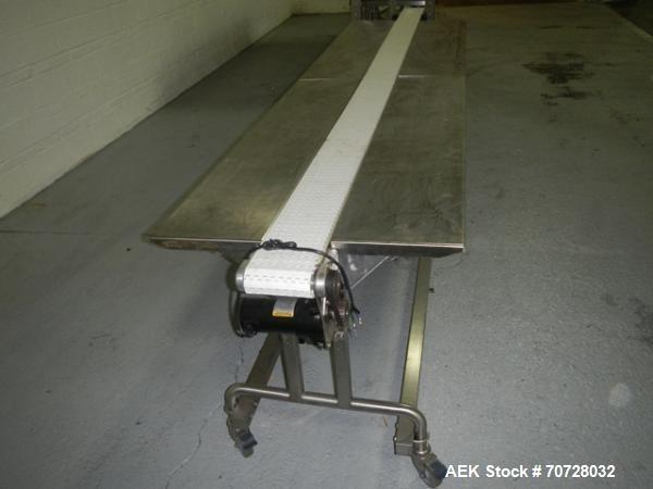 Used Pack off conveyor, 6" wide x 11' long slat conveyor, 12" stainless steel side extensions, .13 hp dc motor drive on stands.