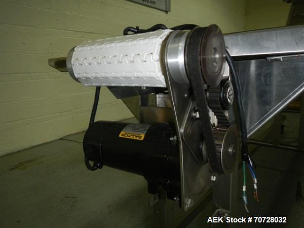 Used Pack off conveyor, 6" wide x 11' long slat conveyor, 12" stainless steel side extensions, .13 hp dc motor drive on stands.
