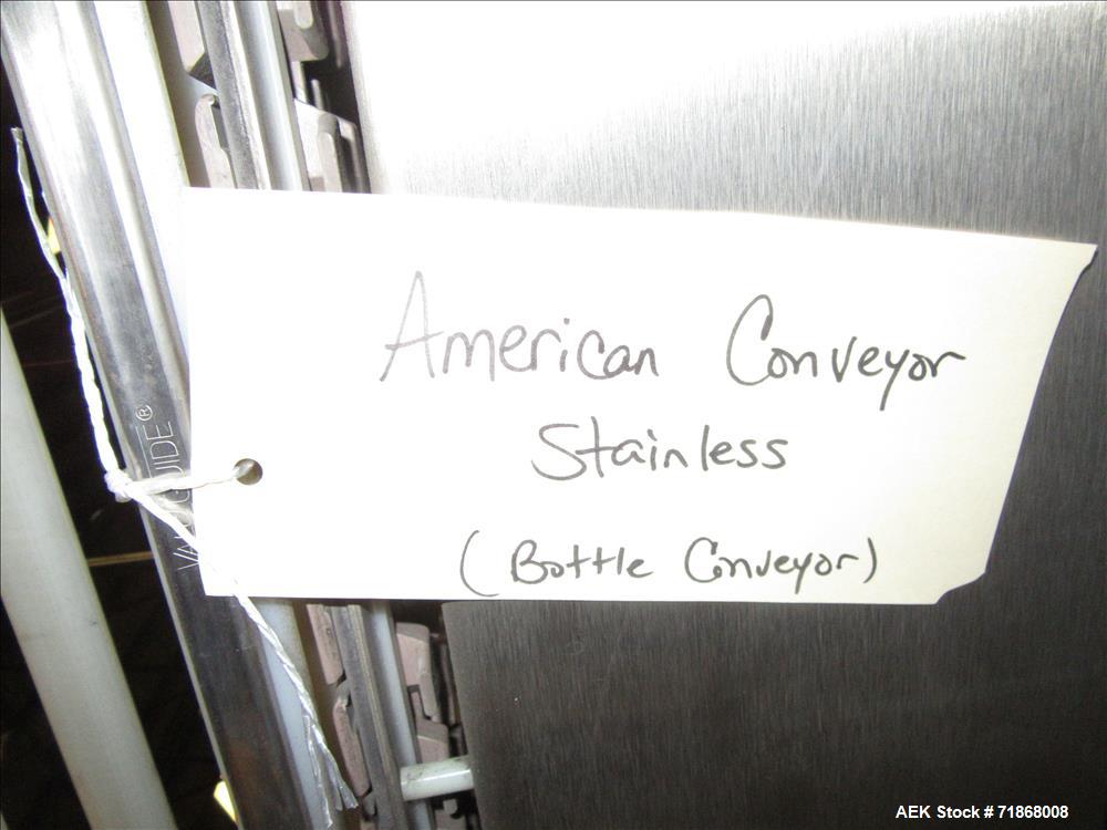 Used American Conveyor stainless steel conveyor system includes (2) Leeson drive motors, (2) 90 degree radius turn sections, and (3) straight runs -SUBJECT TO ENTIRETY BID