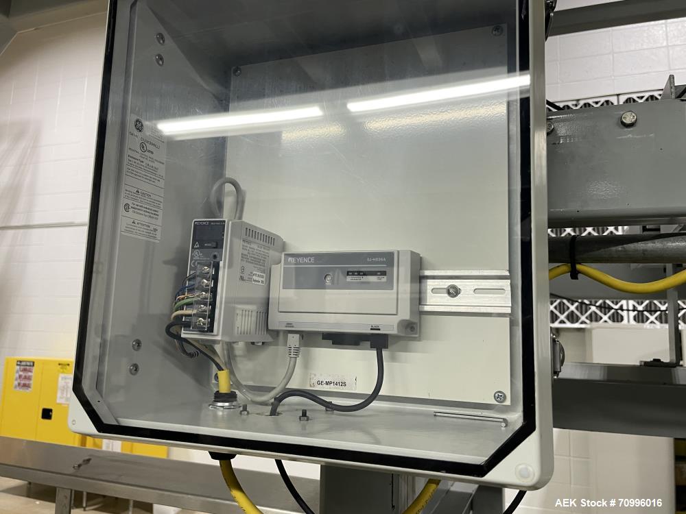 Used Sentry Bottle/cannister Lowerator. Serial Number 1687. Last used with Sentry double high bulk depalletizer with slip sheet dispenser on powdered drink products. Unit is currently installed.