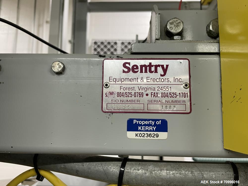 Used Sentry Bottle/cannister Lowerator. Serial Number 1687. Last used with Sentry double high bulk depalletizer with slip sheet dispenser on powdered drink products. Unit is currently installed.