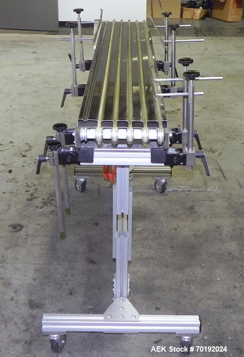 Used Dorner Portable Conveyor with Eagle belting. Unit is 5' long x 8" wide and has (6) Eagle belts. Driven by a 1/8 hp, 130 volt DC gear motor with speed controller. Machine footprint 62" long x 22"...