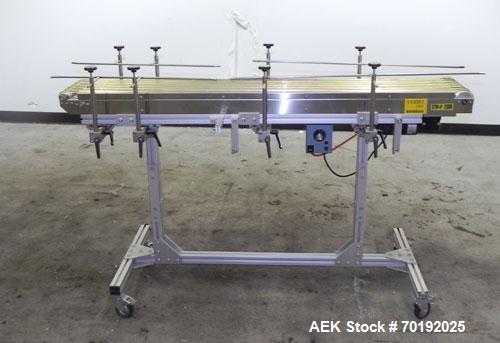 Used Dorner Portable Conveyor with Eagle belting. Unit is 5' long x 8" wide and has (6) Eagle belts. Driven by a 1/8 hp, 130 volt DC gear motor with speed controller. Machine footprint 62" long x 22"...