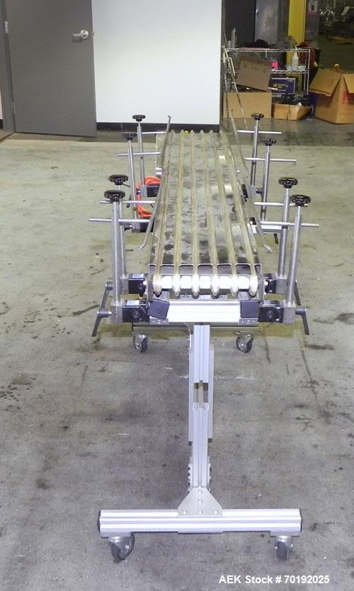 Used Dorner Portable Conveyor with Eagle belting. Unit is 5' long x 8" wide and has (6) Eagle belts. Driven by a 1/8 hp, 130 volt DC gear motor with speed controller. Machine footprint 62" long x 22"...