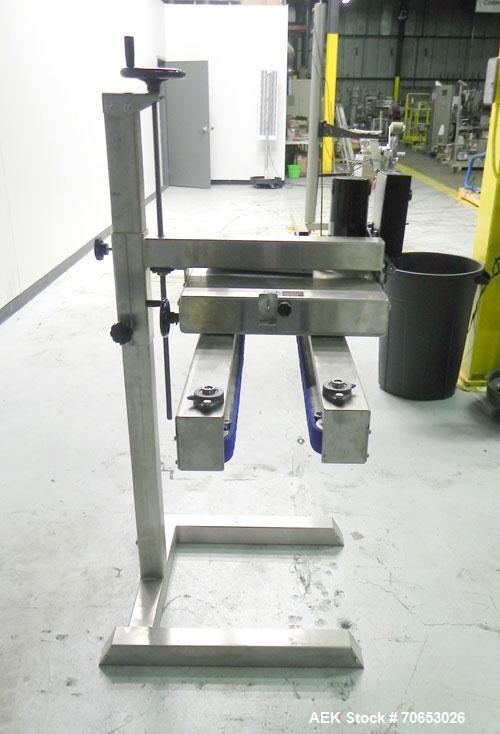 Used Garvey Model 1550 Side Belt Transfer Conveyor. Has Motor Master 20000 variable speed drive. Machine is of stainless steel construction. Has spare conveyor head. 1/3/110V.