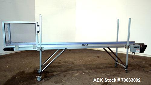 Used HFA Harvard Factory Automation Belt Conveyor.  18" Wide x 156" long belt. Driven by a 1/6 hp, 1/60/115 volt gear motor, ratio 106 to 1, output 82 rpm. Mounted on a manually adjustable height alu...