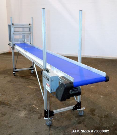 Used HFA Harvard Factory Automation Belt Conveyor.  18" Wide x 156" long belt. Driven by a 1/6 hp, 1/60/115 volt gear motor, ratio 106 to 1, output 82 rpm. Mounted on a manually adjustable height alu...