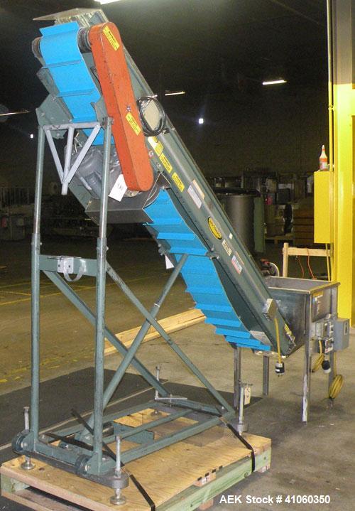 Used Hytrol Incline Belt Conveyor, Carbon Steel. Approximately 10" wide x 96" long belt with 6" long x 1-1/2" deep pockets. 84" discharge height. Driven by a 1/2 HP, 1/60/115-208/230 Volt, 1725 RPM m...