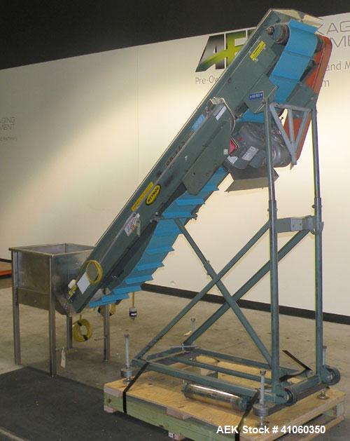 Used Hytrol Incline Belt Conveyor, Carbon Steel. Approximately 10" wide x 96" long belt with 6" long x 1-1/2" deep pockets. 84" discharge height. Driven by a 1/2 HP, 1/60/115-208/230 Volt, 1725 RPM m...