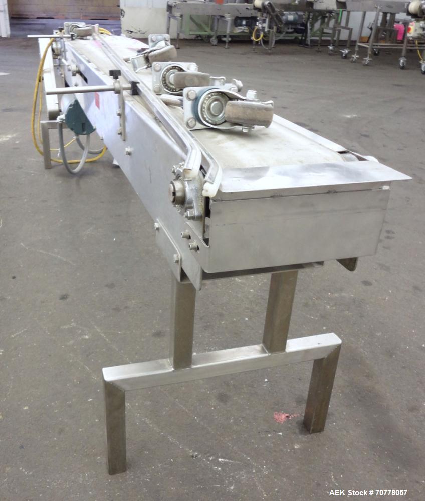 Used Johnson Nash Metal Products Belt Conveyor. Approximately 8" wide x 92" long belt. Stainless steel frame. Mounted on casters. Variable speed controller.